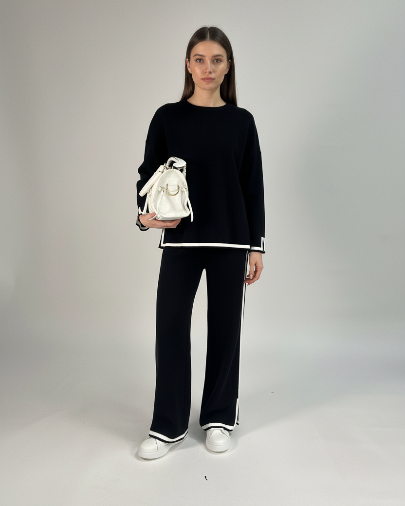 Outfit con modella su sfondo grigio